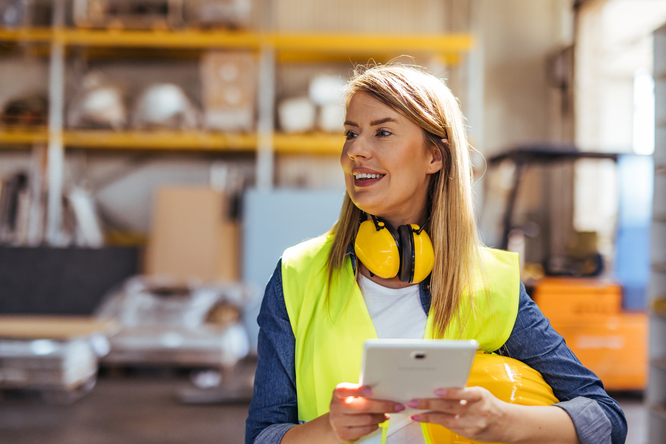 Warehouse operations manager reviewing performance data on a screen